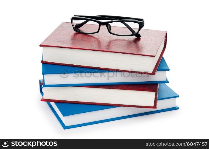 Reading glasses with books isolated on the white