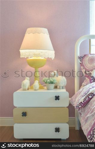 reading lamp on bedside table in sweet bedroom