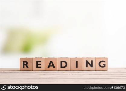 Reading sign made of wood on a table