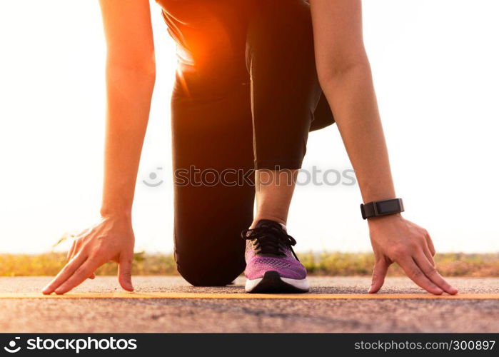 Ready go. running woman on start position and going to run on long road