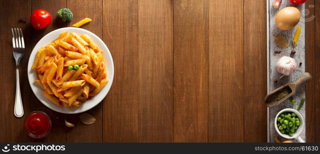 ready pasta on wooden background