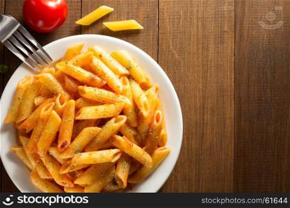 ready pasta on wooden background