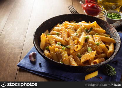 ready pasta on wooden background