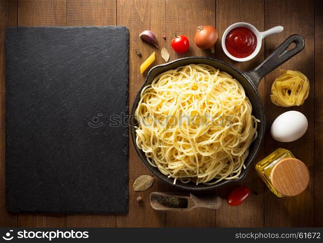ready pasta on wooden background