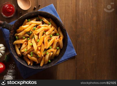 ready pasta on wooden background