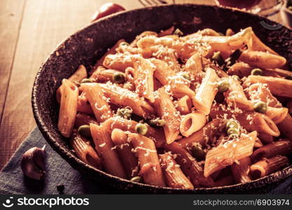 ready pasta on wooden background