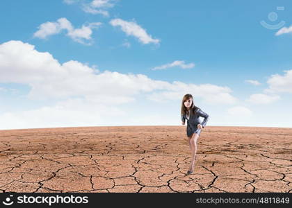 Ready to run. Young determined businesswoman standing in start position