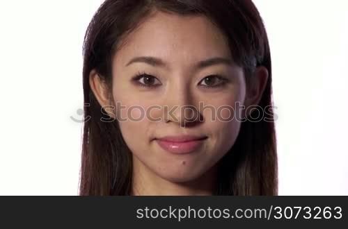 Real Asian people portrait with emotions and feelings. Close up of face on white background. Beautiful young happy Japanese woman smiling, lady, pretty girl looking at camera. Joy, female beauty