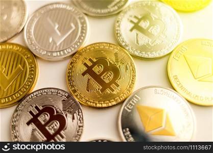 Real bitcoin litecoin and ethereum coins together on surface. Real bitcoin litecoin and ethereum coins together