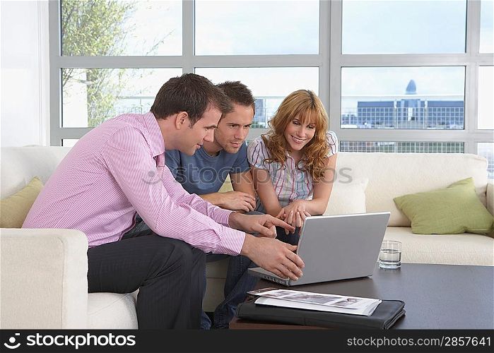Real Estate Agent and Couple in Meeting
