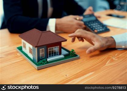 Real estate agent calculate tax and interest, discuss ownership term and insurance agreement with client for house loan and property purchase. Financial advisor for investment budget. Fervent. Real estate agent calculate tax and interest discuss with buyer. Fervent