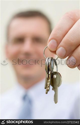 Real-estate agent handing over keys