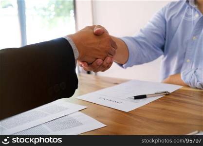 Real estate agent handshake. Business partnership meeting concept. and home insurance