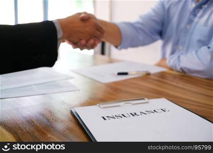 Real estate agent handshake. Business partnership meeting concept. and home insurance