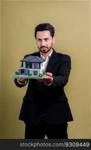 Real estate agent hold house model sample on isolated background. Housing business showcase with copy space. Realtor presenting property investment opportunity on house loan idea. Fervent. Real estate agent hold house model sample on isolated background. Fervent