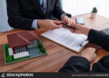 Real estate agent review tax and interest calculation, insurance agreements terms with client for property purchase and house loan. Financial advisor help clients manage investment budget. Jubilant. Real estate agent review tax and interest calculation with client. Jubilant