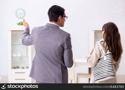 Real estate agent showing new apartment property to client