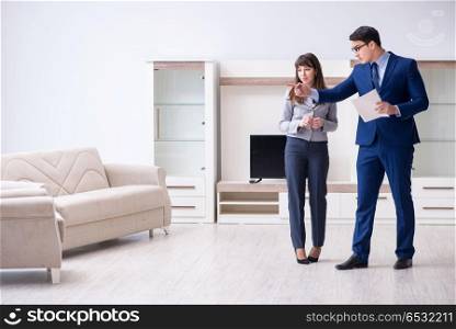 Real estate agent showing new apartment to owner