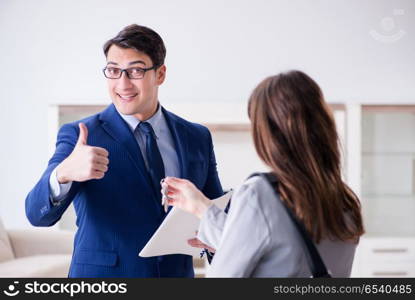 Real estate agent showing new apartment to owner