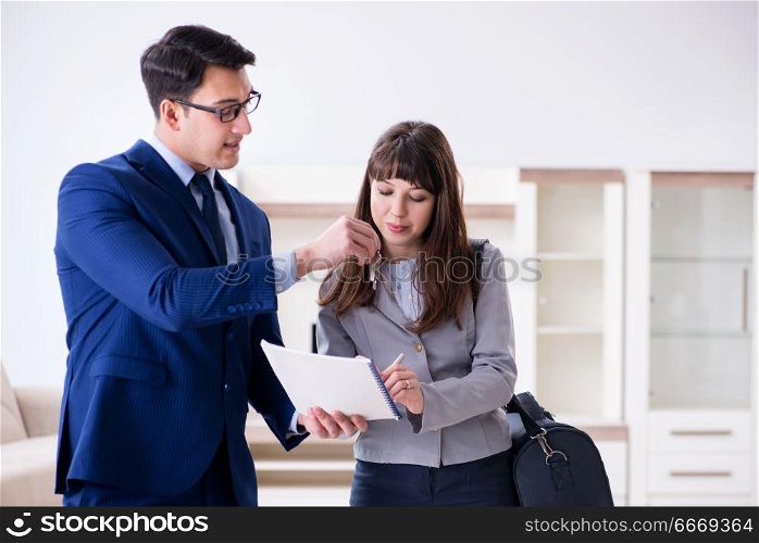 Real estate agent showing new apartment to owner