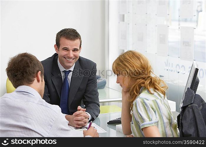 Real Estate Agent With Couple