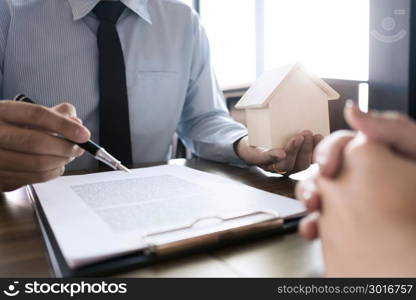 real estate agent with customer making an agreement