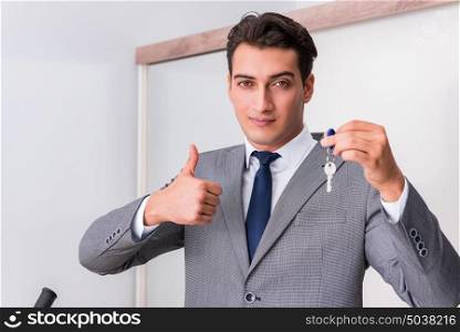 Real estate agent with key from new house