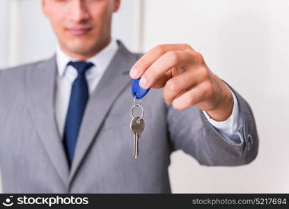Real estate agent with key from new house