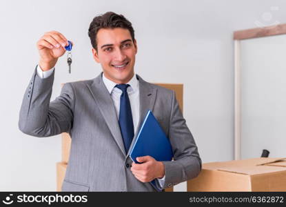 Real estate agent with key from new house