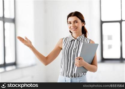 real estate business and people concept - businesswoman or realtor with folder at office. businesswoman or realtor with folder at office. businesswoman or realtor with folder at office