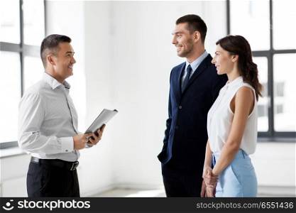 real estate business, sale and people concept - happy smiling realtor with folder meeting customers at new office. happy realtor meeting customers at new office. happy realtor meeting customers at new office