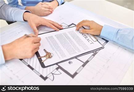 real estate business, sale and people concept - male realtor&rsquo;s hands and customers signing property purchase contract at office. hands signing property purchase contract at office