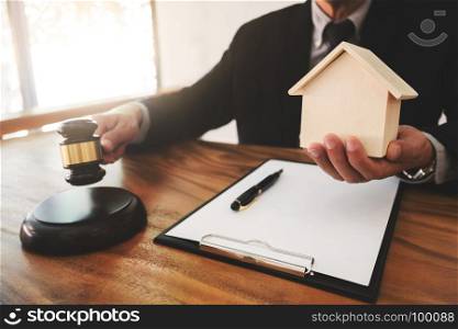 Real Estate concept, judge gavel / lawyer in auction with house model