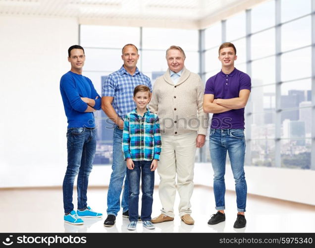 real estate, gender, generation and people concept - group of smiling men and boy over empty apartment or office room background