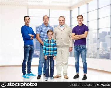 real estate, gender, generation and people concept - group of smiling men and boy over empty apartment or office room background