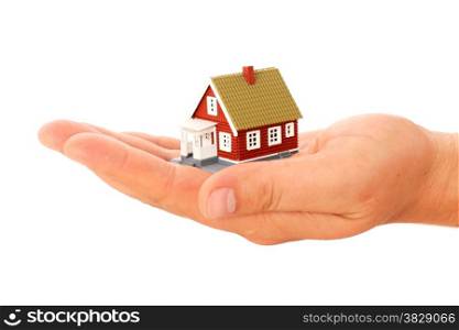Real estate. House in hand isolated over white.
