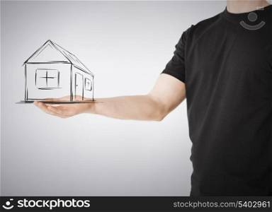 real estate, technology and accomodation concept - picture of house on virtual screen in man hand