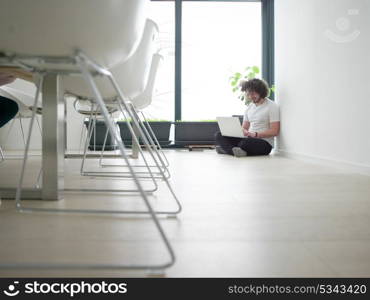 Real man Using laptop on the floor At Home Enjoying Relaxing