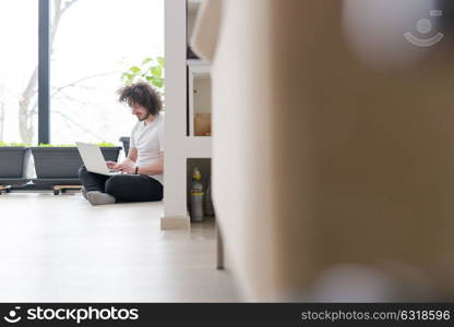 Real man Using laptop on the floor At Home Enjoying Relaxing