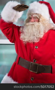 Real Santa Claus standing at airport and waiting for his flight