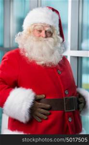 Real Santa Claus standing at airport and waiting for his flight