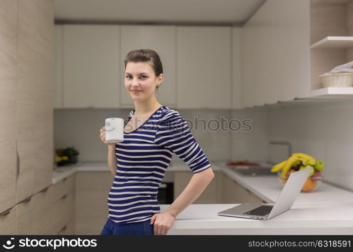 Real Woman Using laptop At Home Drinking Coffee Enjoying Relaxing