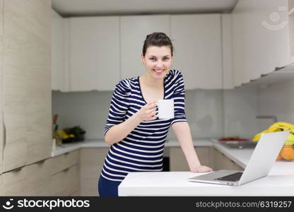 Real Woman Using laptop At Home Drinking Coffee Enjoying Relaxing