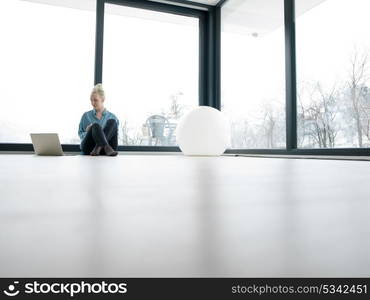 Real Woman Using laptop At Home on the floor Drinking Coffee Enjoying Relaxing