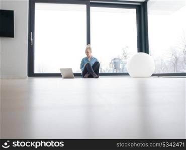 Real Woman Using laptop At Home on the floor Drinking Coffee Enjoying Relaxing