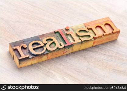 realism word abstract in letterpress wood printing blocks stained by color inks