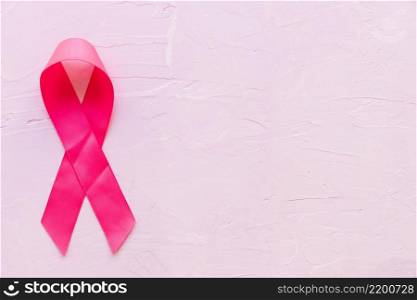 realistic pink ribbon showing breast cancer awareness symbol pink stone