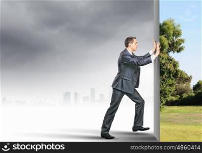 Reality change. Image of young business man changing reality