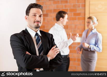 Realtor in an empty apartment with some clients looking for real estate