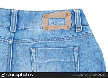 Rear pocket of blue jeans with leybom isolated on white background